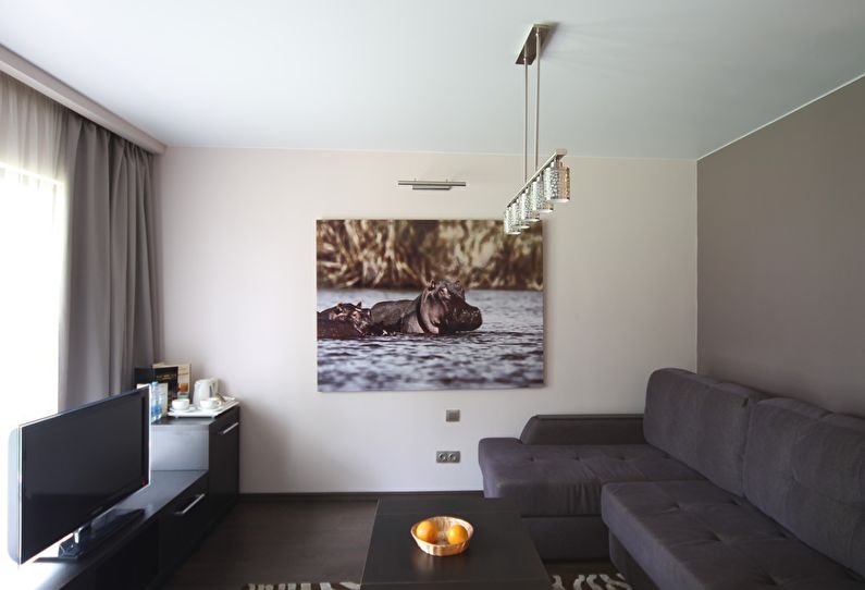 Matte stretch ceiling in the living room interior