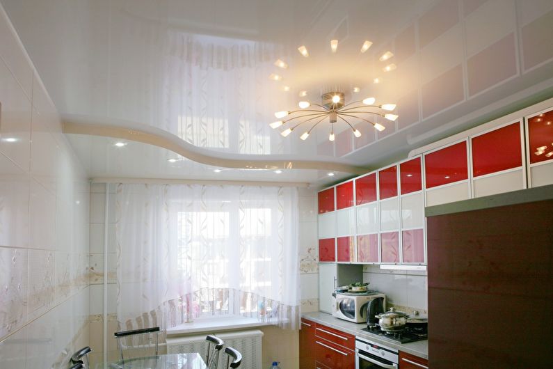 White glossy stretch ceiling in the kitchen - photo