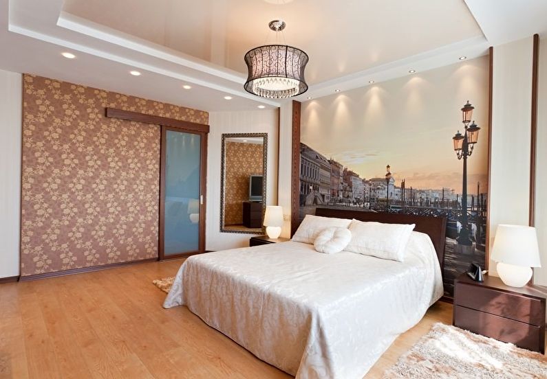 Beige glossy stretch ceiling in the bedroom - photo