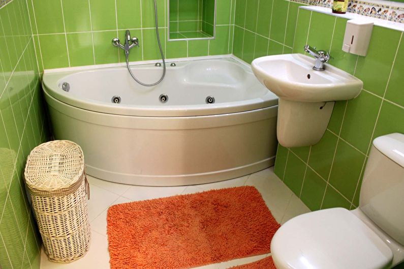 Diseño de un baño pequeño en colores verdes.