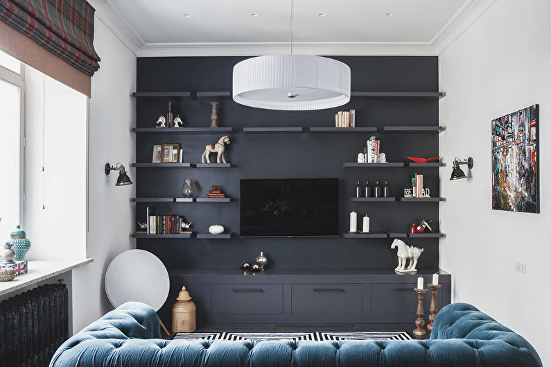 De combinatie van kleuren in het interieur van de woonkamer - zwart met blauw en wit