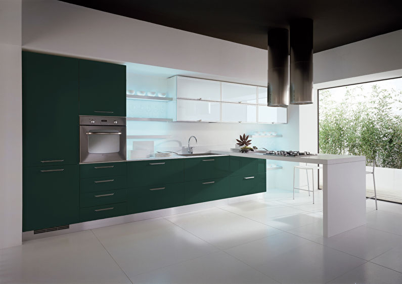 The combination of colors in the interior of the kitchen - green with white and black