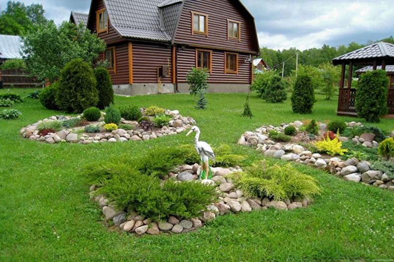 Jardín de piedra - Macizo de flores en la cabaña, ideas para el diseño del paisaje