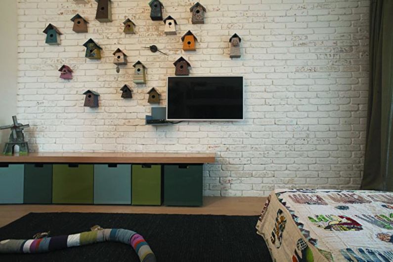 Brick wall in the interior of a children's room - photo