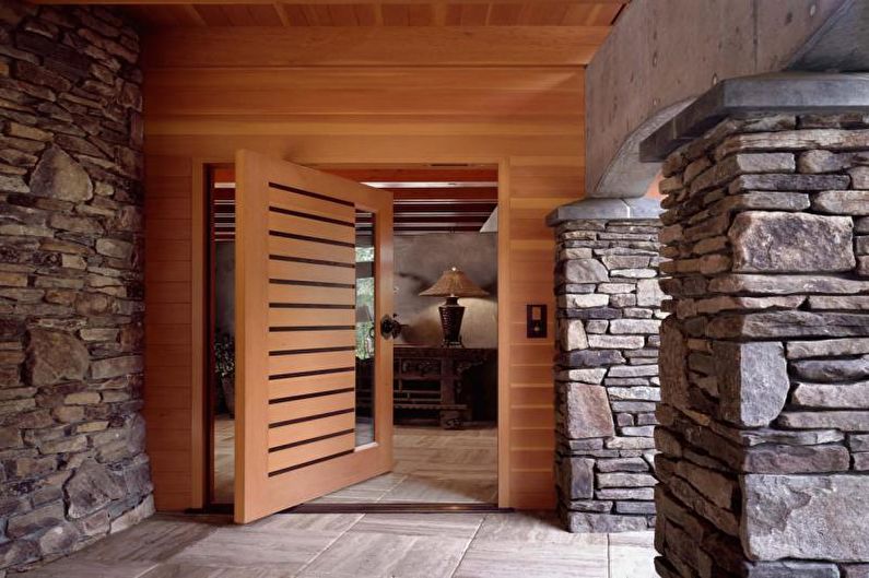 Decorative stone in the interior of the hallway - photo