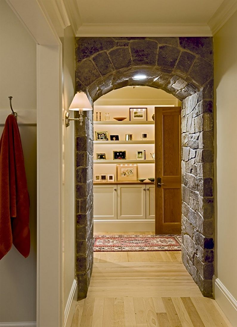 Decorative stone in the interior of the hallway - photo