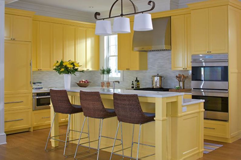 Kitchen interior design in yellow - photo