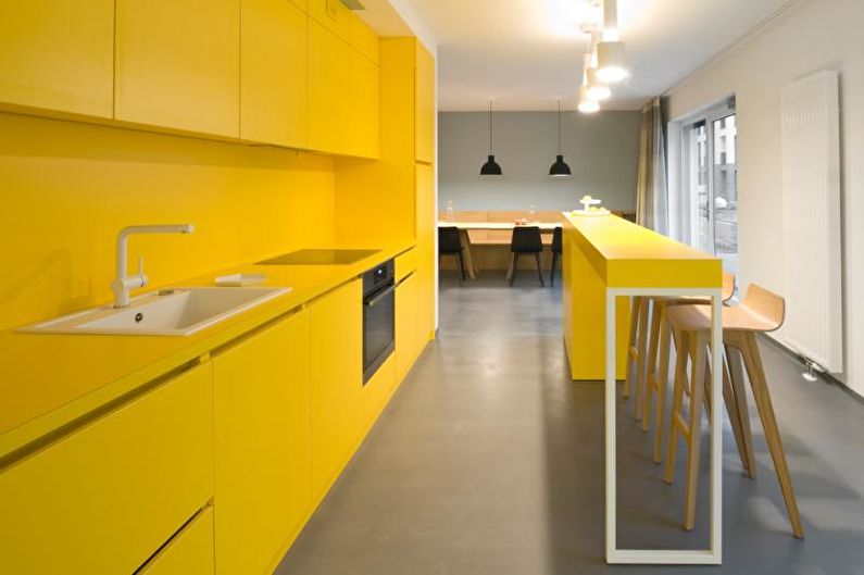 Kitchen interior design in yellow - photo