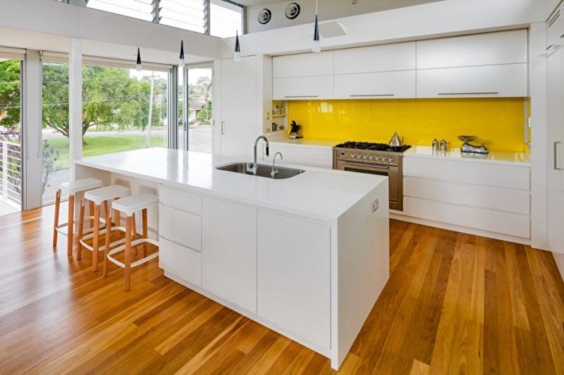 Kitchen interior design in yellow - photo