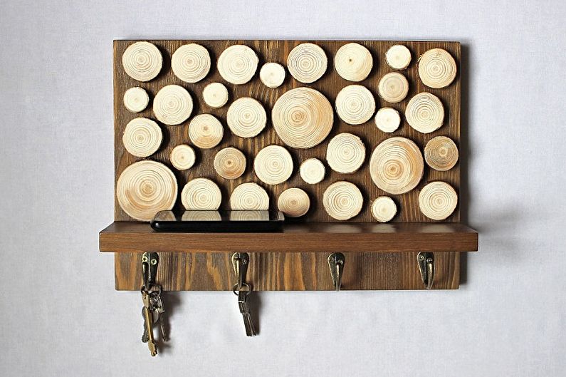 Do-it-yourself wall-mounted key holder for a hall made of wood saw