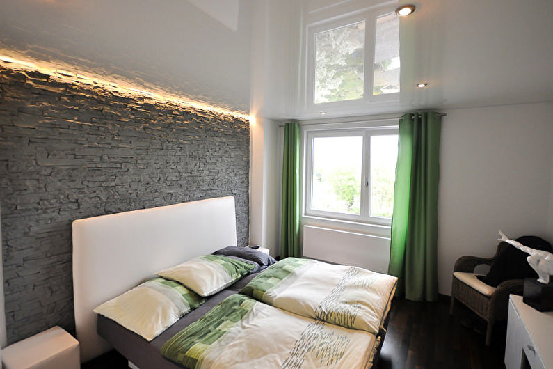 Stretch ceilings in the bedroom - photo