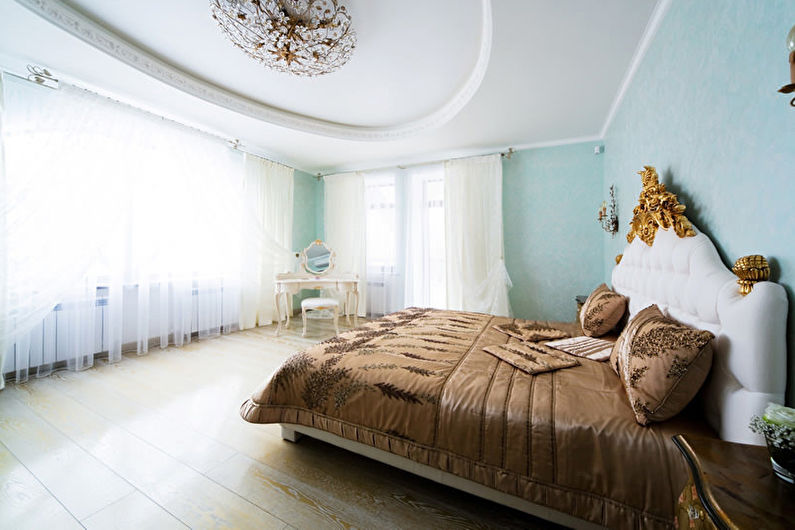 Stretch ceilings in the bedroom - photo