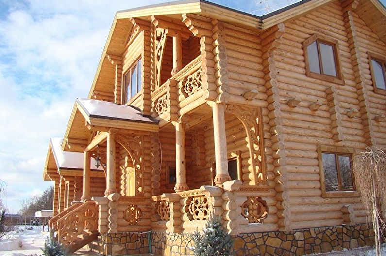 Modern projects of log houses - House made of logs with decorative carvings