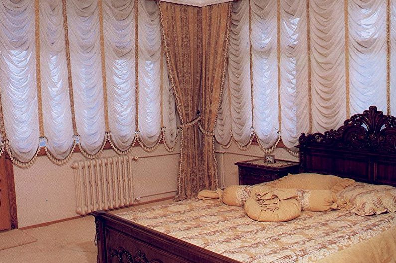 French curtains in the interior of the bedroom