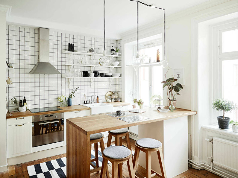 Cucina in stile scandinavo bianco con bar per la colazione - interior design