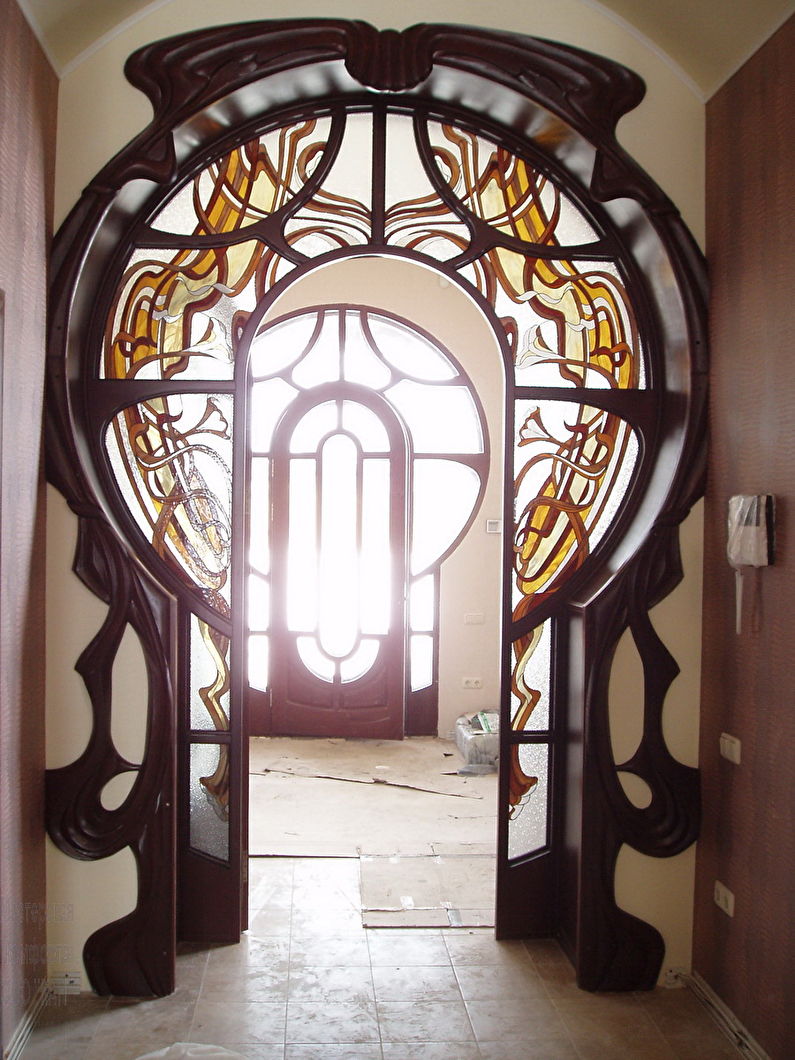 Stained-glass window - decoration and decoration of a gypsum plaster arch