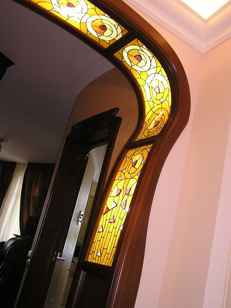 Stained-glass window - decoration and decoration of a gypsum plaster arch