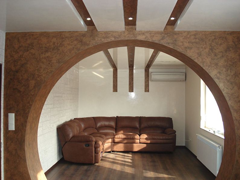 Round plasterboard arch in a small living room - design