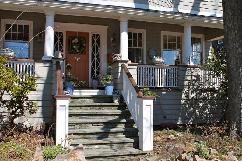 Porch decoration with steps and rails for a private house - photo