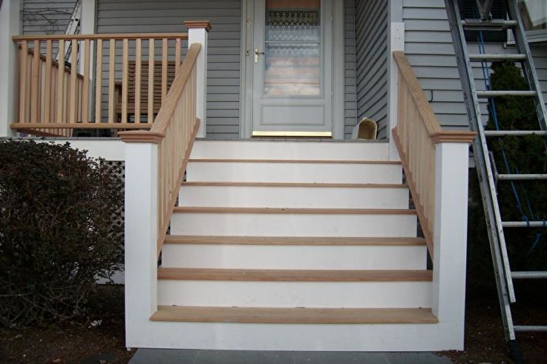 Porch decoration with steps and rails for a private house - photo